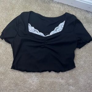 black shirt with lacey part on chest